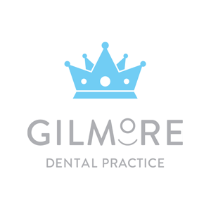 Logo of Gilmore Dental Practice featuring a blue crown and text.