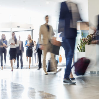 Blurred motion of business people walking at convention center