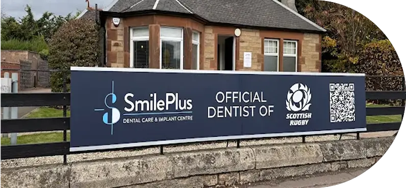 Sign for SmilePlus Dental Care and Implant Centre, indicating official partnership with Scottish Rugby.