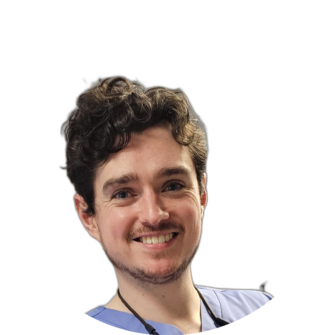 Graham McAughtrie smiling in blue scrubs, a dental practitioner at Clyde Munro Dental, photographed for staff profile and site imagery